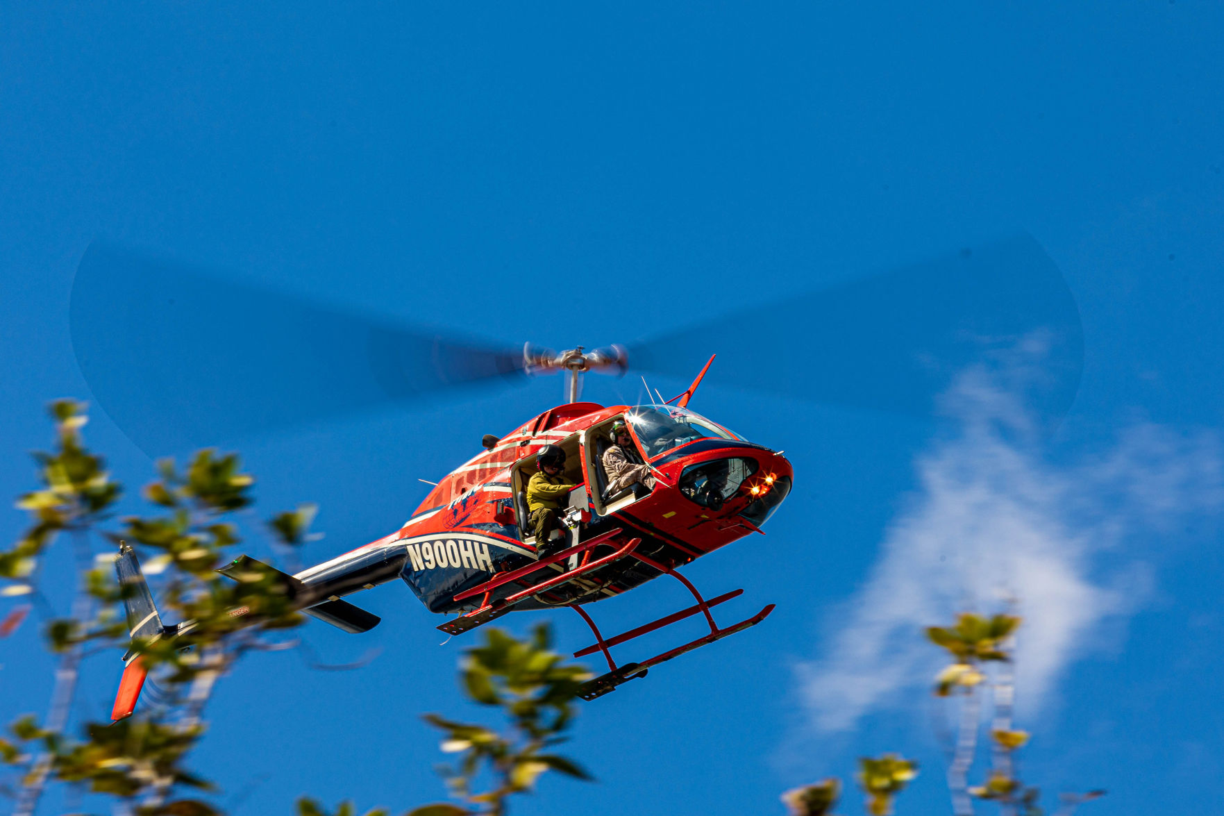 Helicopter crews flew at tree-top level to dispense ping-pong ball size fire starters and help monitor progress of the burns.